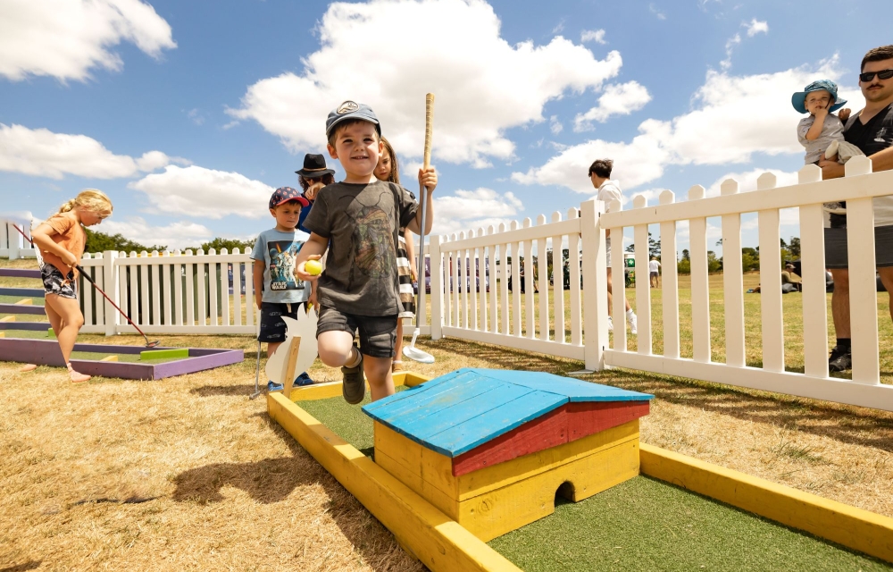 Child playing outdoor games at picnic in the park