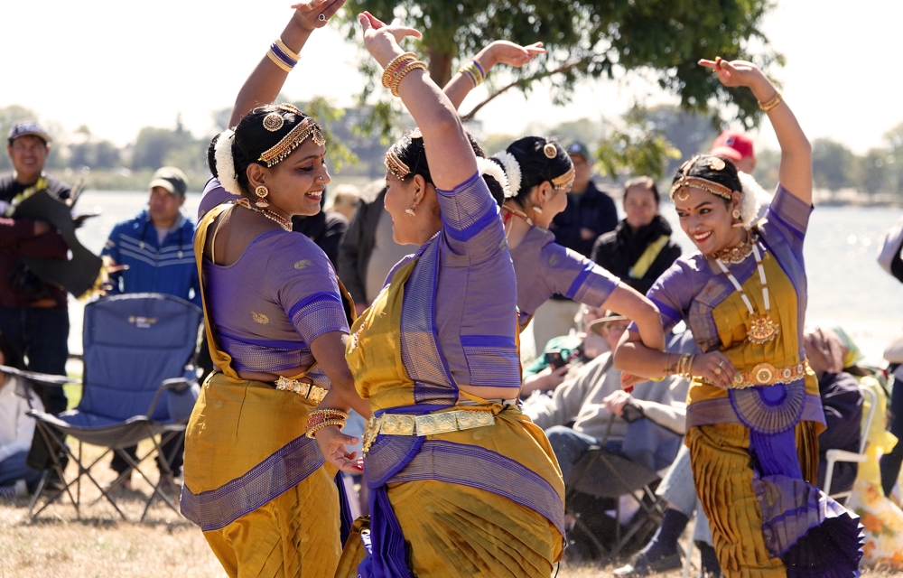 image of ladies performing and traditional clothing