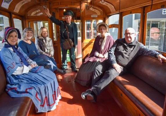 Mayor Des Hudson with Ballarat Tramway Museum conductor and women from Sovereign Hill and Craft Lab 23