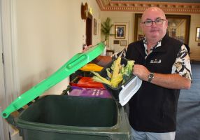 Mayor Des Hudson holding FOGO waste
