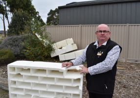 City of Ballarat Mayor Cr Des Hudson stands next to a stray waffle pod. 