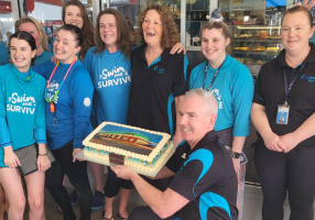 BALC staff with a celebratory cake to celebrate winning Victorian Swim Centre of the Year for its ‘Learn to Swim’ program
