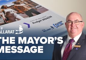 Text with The Mayor's Message with an image of Mayor Cr Des Hudson in front of the 2024/25 Budget document