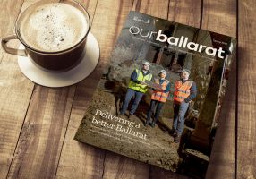 ourballarat magazine next to a coffee on a table