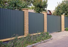 Brick and metal fence
