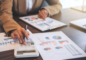 Image of someone looking at expenses sheets