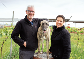 Michael Unwin and his wife Catherine with their dog Poppy at the site of the new Unwin Winery cellar door and  vineyard at Cardigan.