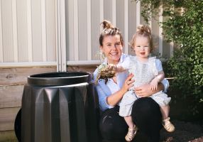 City of Ballarat Environmental Support Officer Emma Swift shows Marley Jones how to make compost