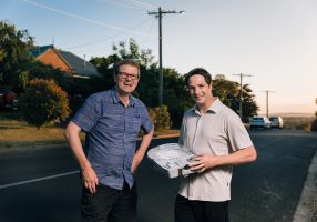 Project Officers holding LED light 