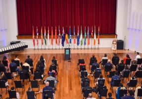 a citizenship ceremony in a large hall