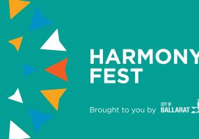 Text of harmony fest on a blue-green background