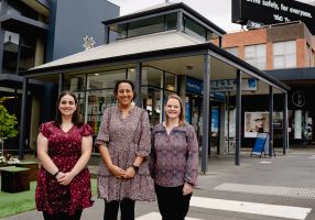Three women standing out the front of parent place in central Ballarat