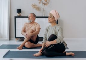 An Elderly Couple Exercising Together